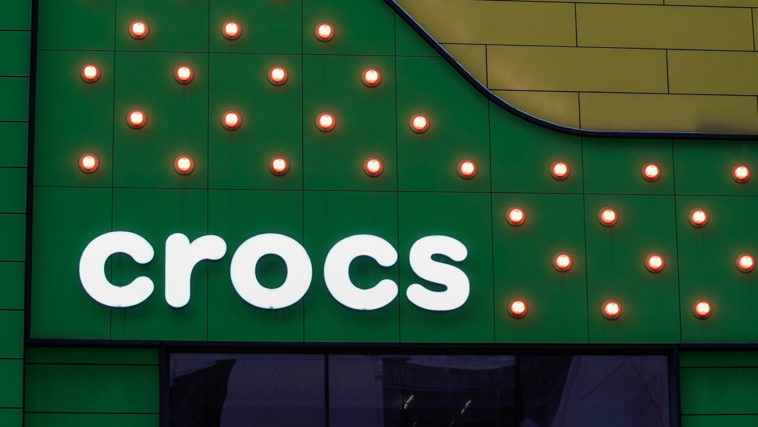 Crocs logo on green background