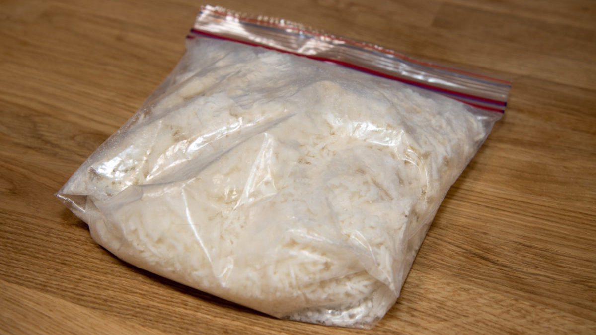 Ziploc bag of frozen cooked rice on counter