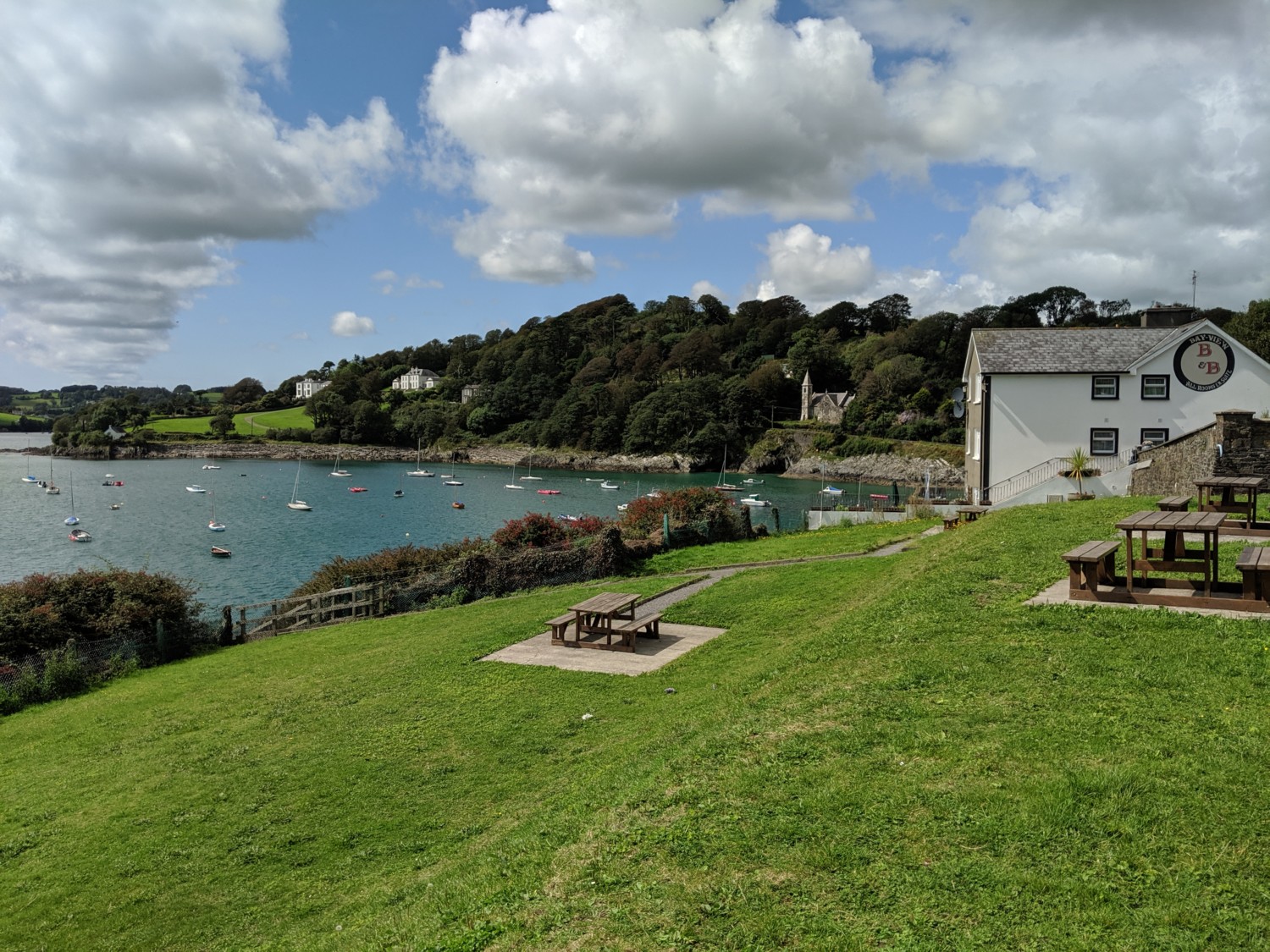 A waterfront view of a park in Glandore, Ireland