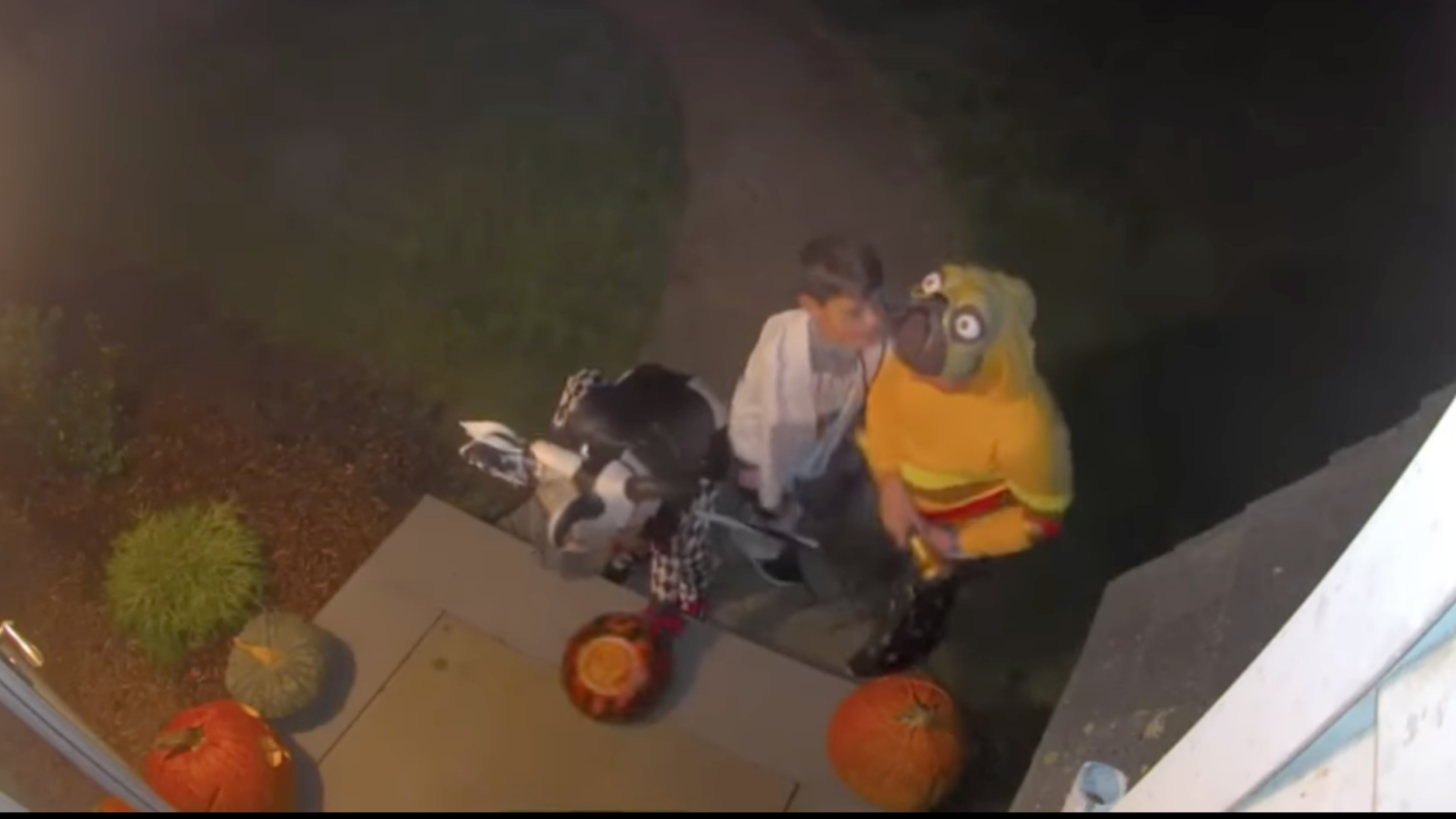 Trick or treaters put candy in bowl in Rhode Island