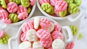 pink, green and white cream cheese mints in bowls