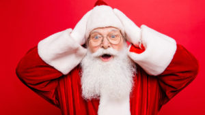 Santa Claus looks at the camera in amazement
