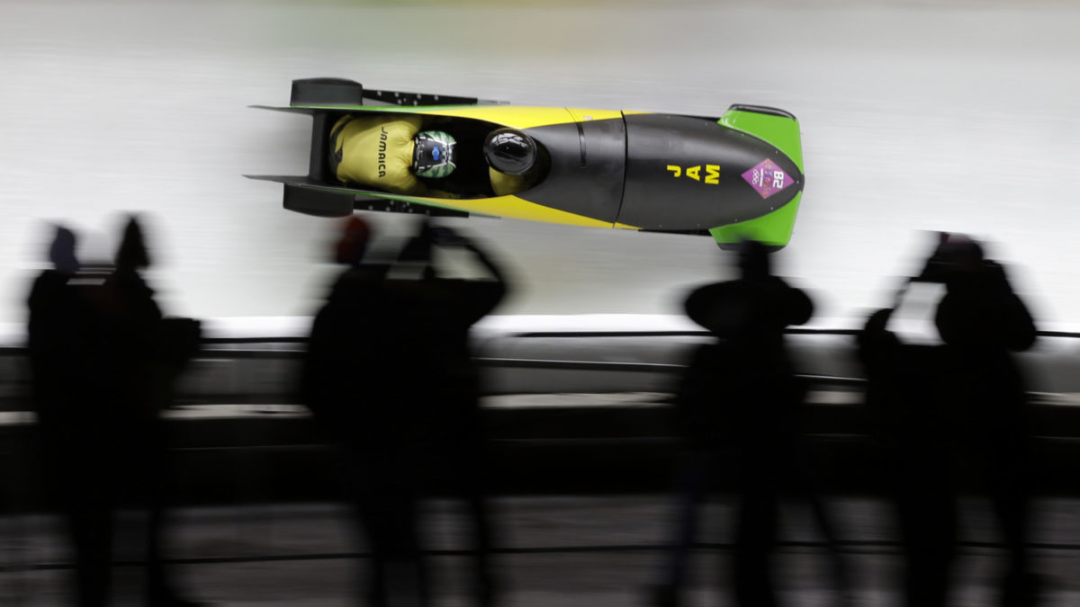 Jamaican bobsled team competes on the track at the Sochi Winter Olympics in 2014.