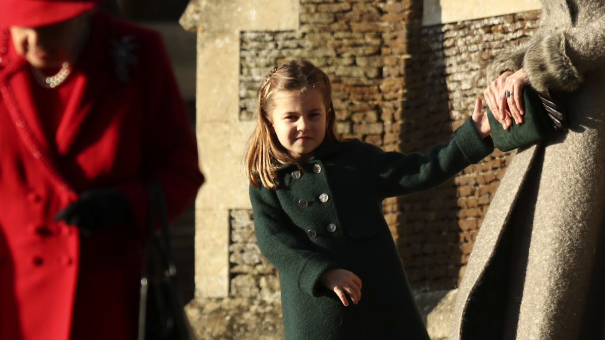 Princess Charlotte holds her mother, Duchess Kate's hand at Christmas in 2019.