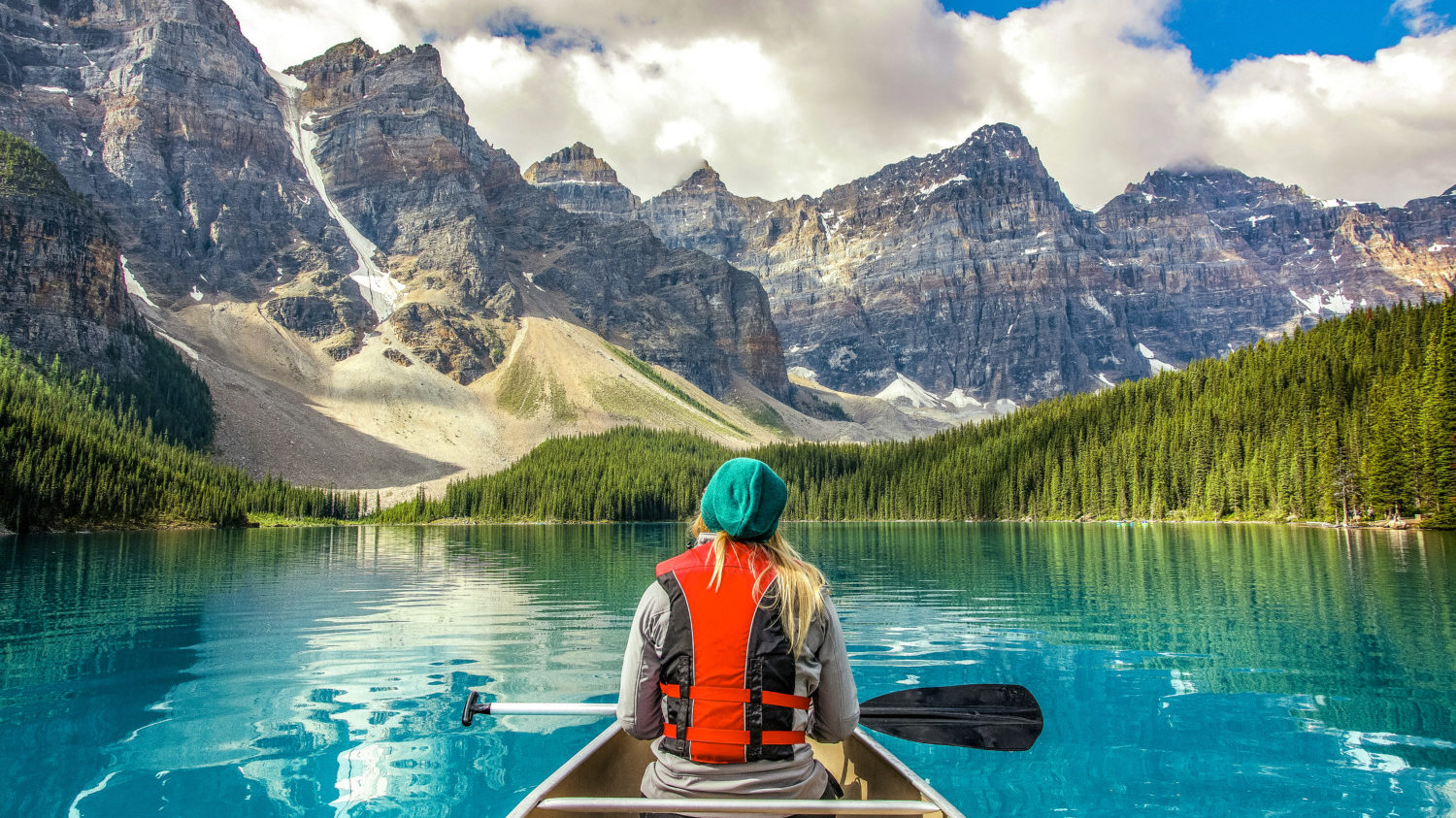 Woman in canoe, Moraine Lake, Banff National Park, Canada