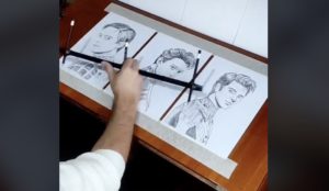 Artist Eduardi Tsokolakyan sketches 3 portraits at once