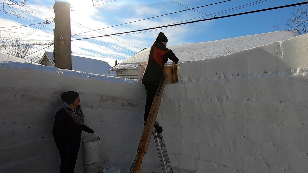 Theresa Rojek and Jeff Brown build backyard igloo