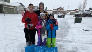 Mathill family shovels snow for military spouses