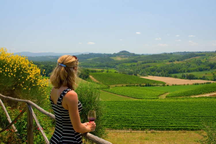 A woman tourist in Tuscany Italy with wine