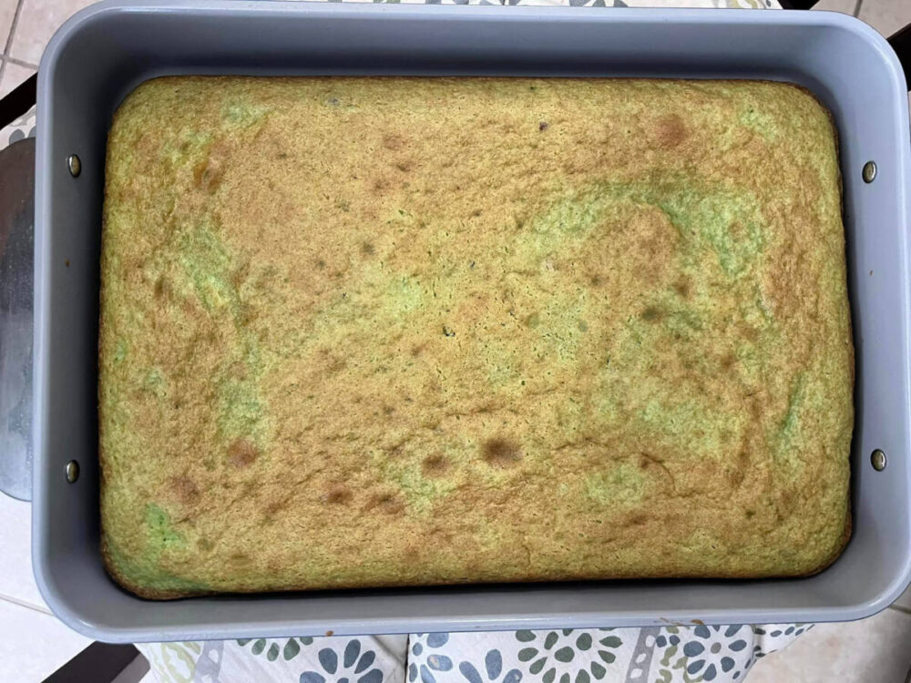 Baked green pistachio cake in pan