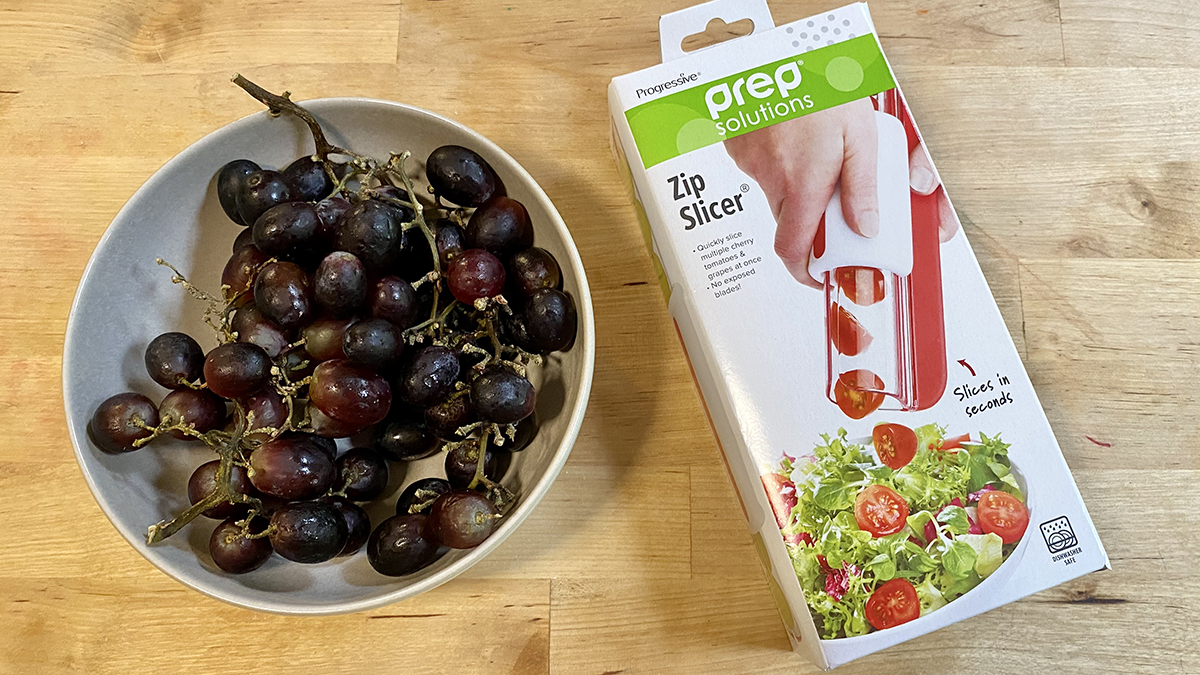 The Zip Slicer is shown with a bowl of grapes.