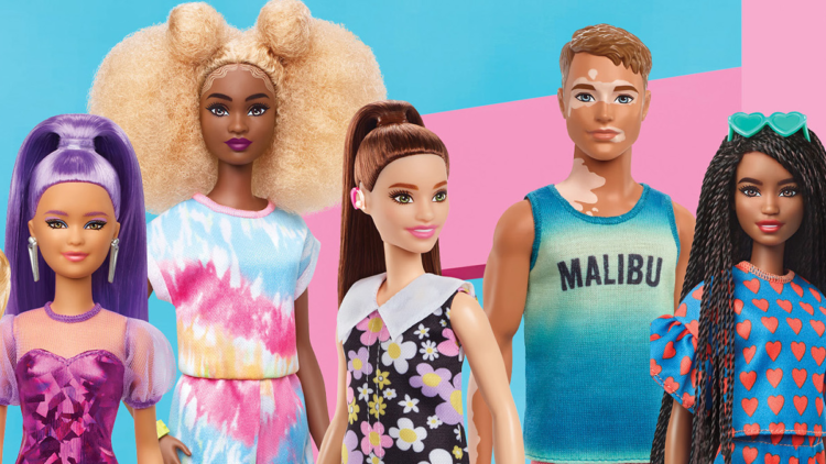 Several new dolls for 2022, including Barbie's first doll with a hearing aid, are shown.
