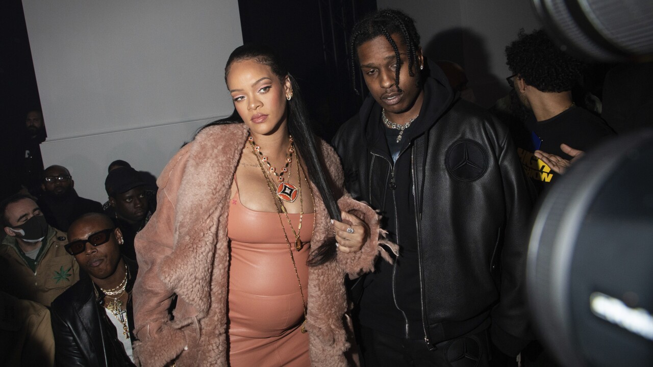 Rihanna, left, and ASAP Rocky arrive for the Off-White Ready To Wear Fall/Winter 2022-2023 fashion collection, unveiled during the Fashion Week in Paris, Monday, Feb. 28, 2022.