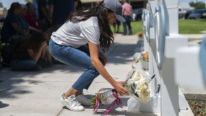Meghan Markle, Duchess of Sussex, leaves flowers at a memorial site in Uvalde, Texas.