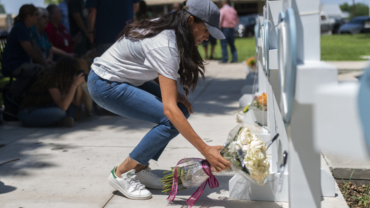 Meghan Markle, Duchess of Sussex, leaves flowers at a memorial site in Uvalde, Texas.