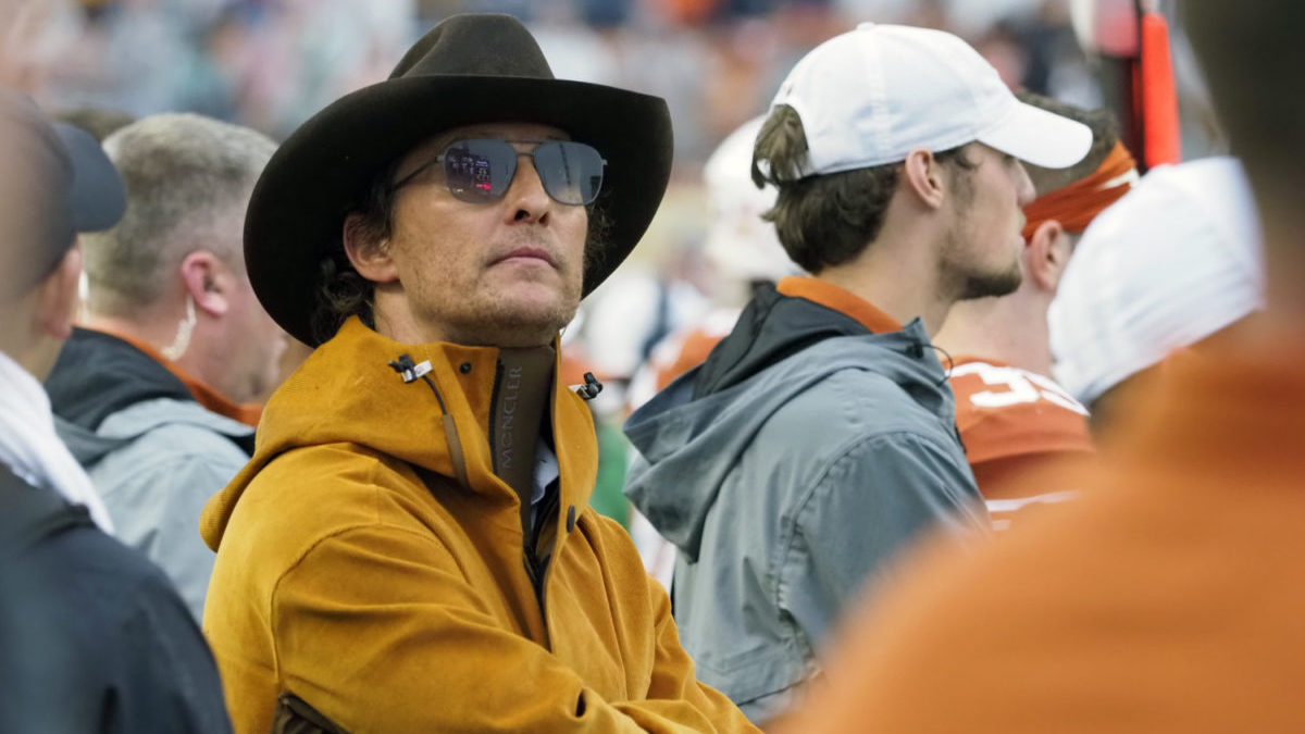 Actor Matthew McConaughey stands on the sideline of a University of Texas football game in 2019.