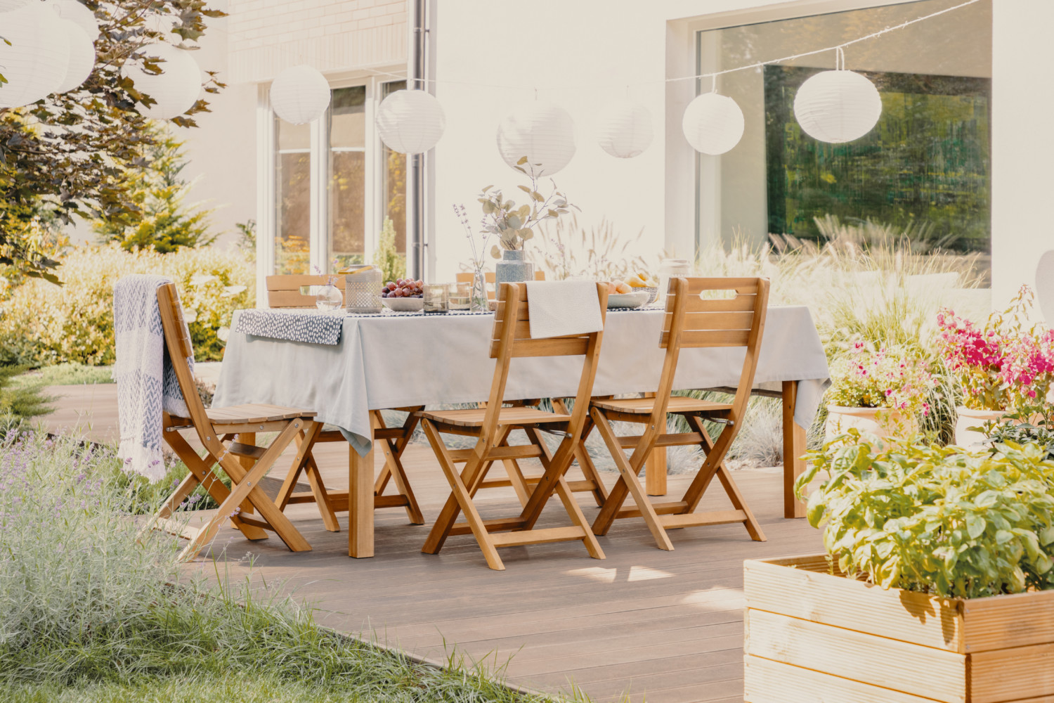Outdoor dining room with wooden garden furniture set with table