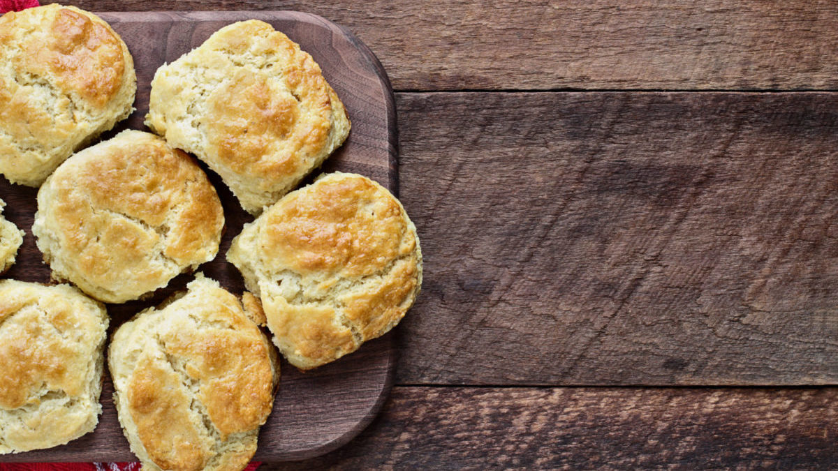 Buttermilk Southern Biscuits on Cutting Board Over Rustic Wood.