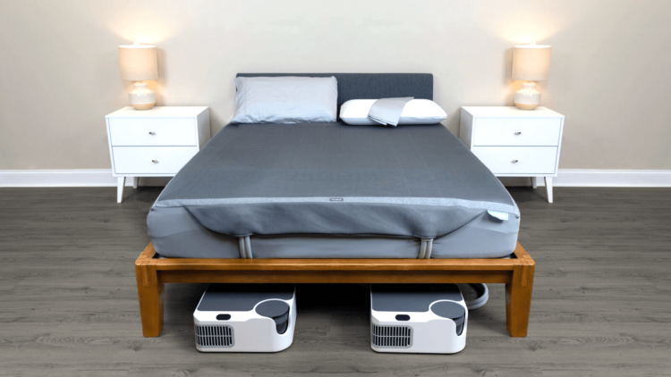 Sleepme's Dock Pro mattress cooling system is shown in use.