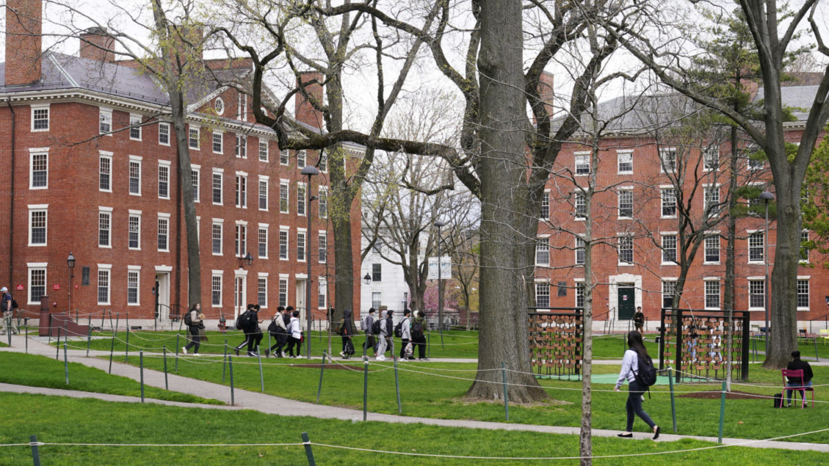 Students walk across the campus at Harvard University.