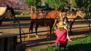 Girl with horses at Sorrel River Ranch Resort