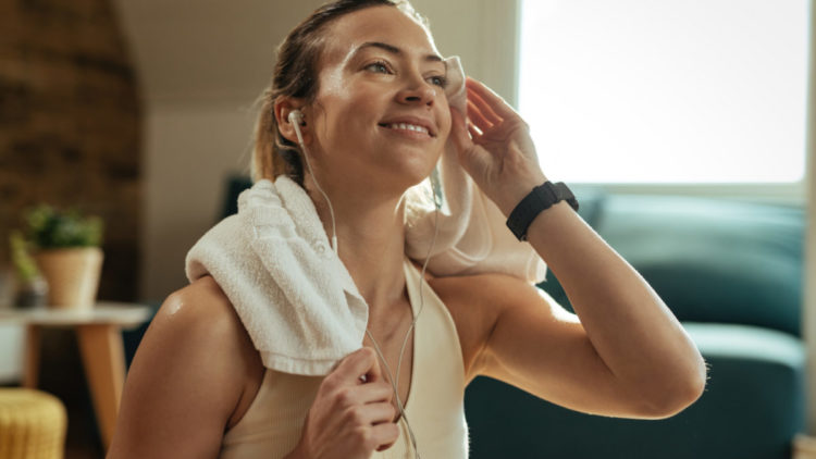 Woman sweating after a workout at the gym.