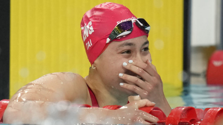 Swimmer Alice Tai wins 100m backstroke gold