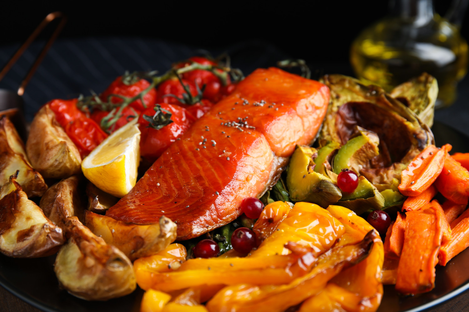 cooked salmon on plate with vegetables