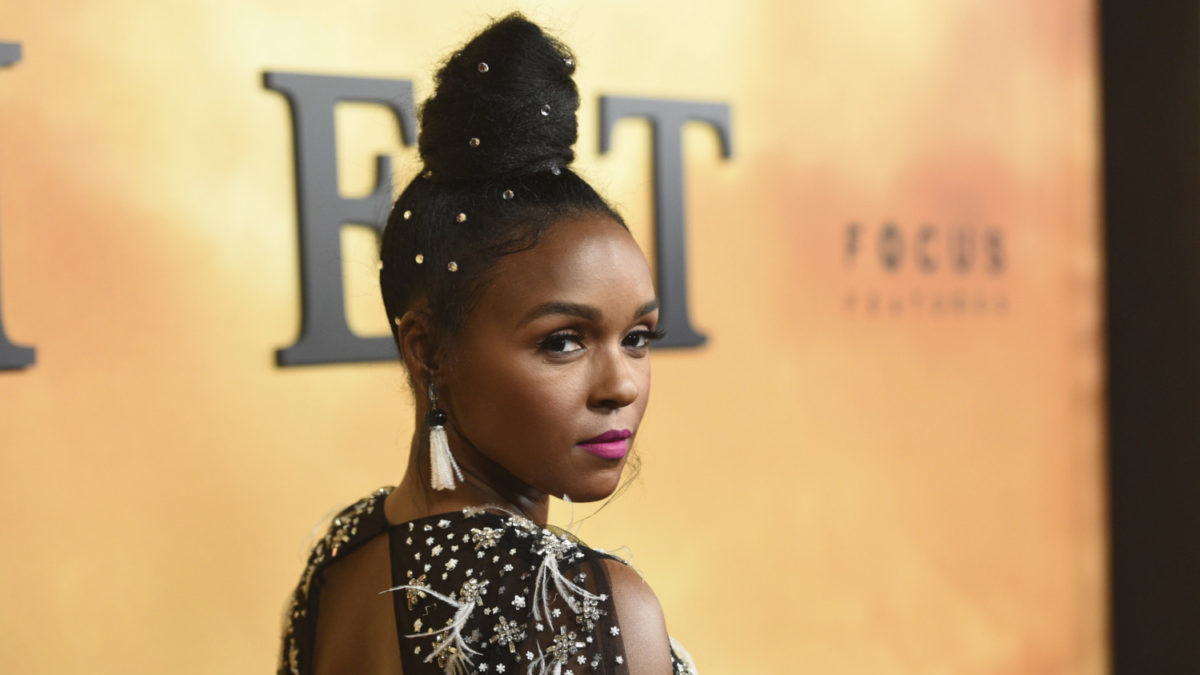 Janelle Monae wears gems in her hair on the red carpet.