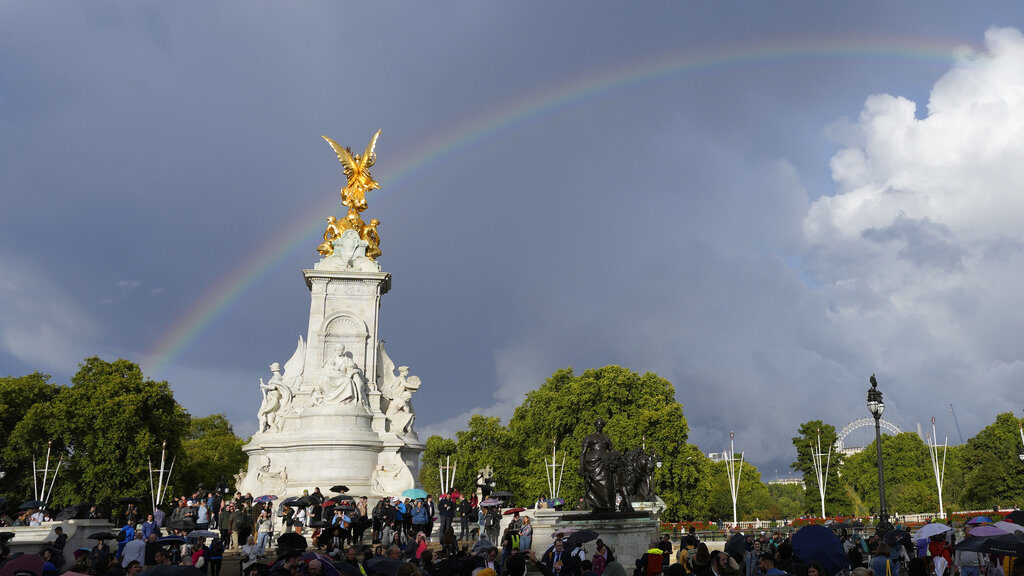 Rainbow appears as people gather at Buckingham Palace