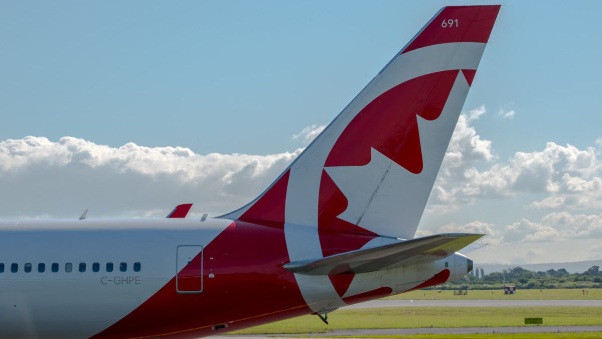 The tail of an Air Canada Rouge Boeing 767.