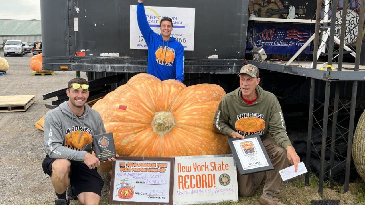 Andrusz family with their giant pumpkin