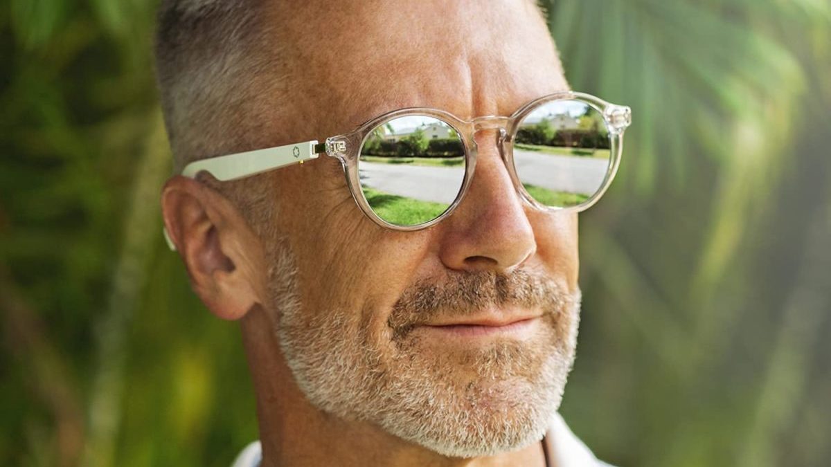 A man models Lucyd Lyte Bluetooth audio sunglasses, which have speakers built into the temples.