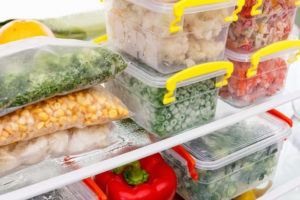 Frozen foods sit in the refrigerator to thaw