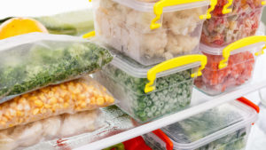 Frozen foods sit in the refrigerator to thaw