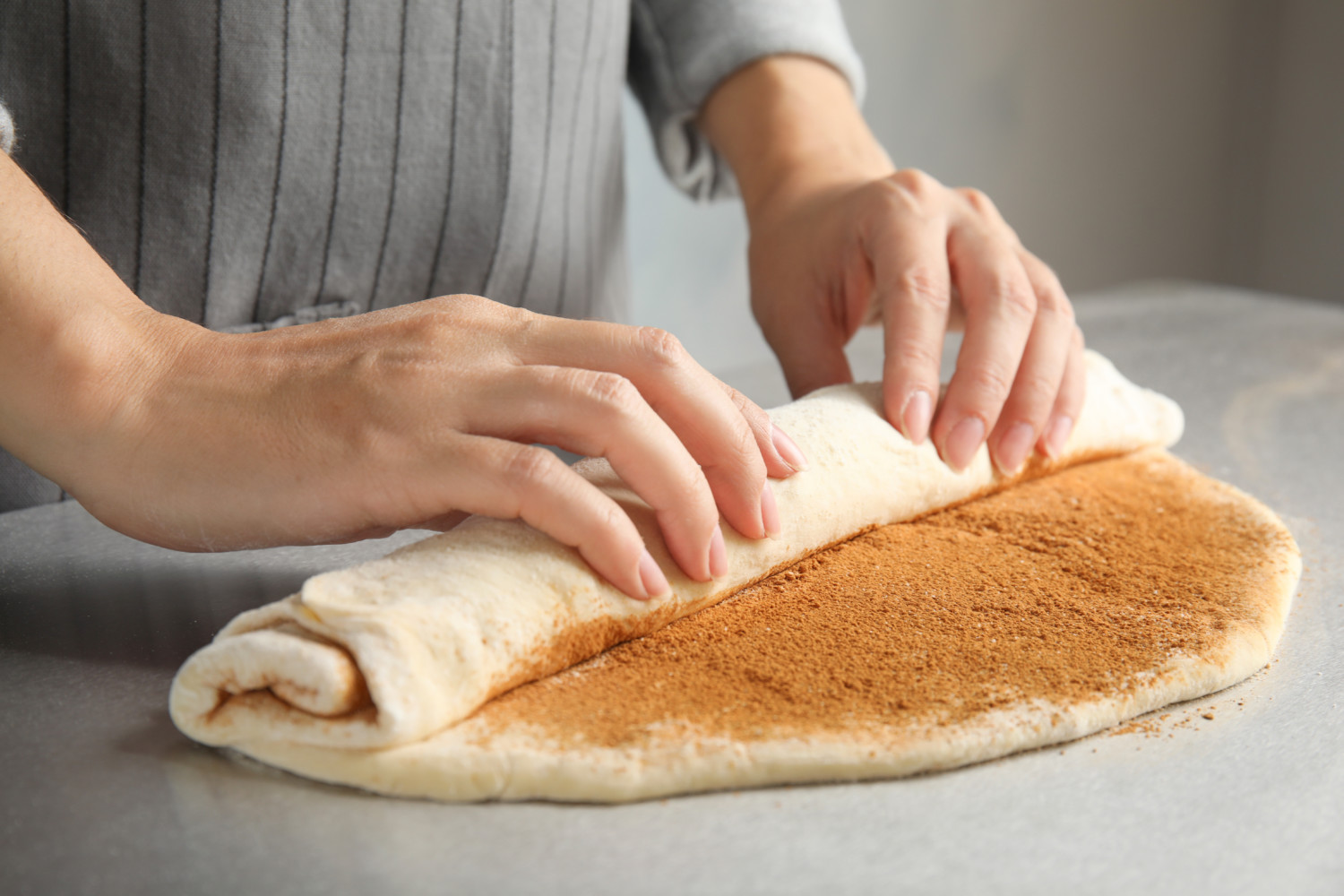 Woman making cinnamon rolls