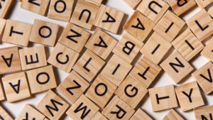 Scrabble letters scattered on table