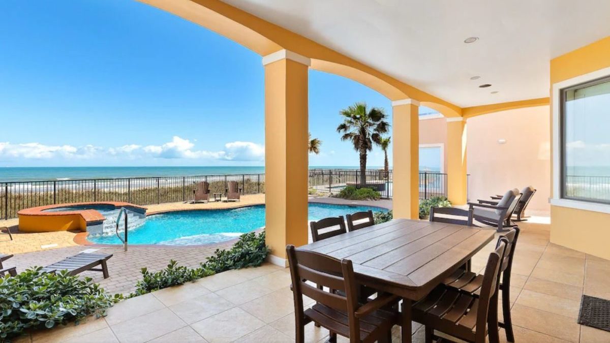 The backyard of a Vrbo rental in South Padre Island, Texas, is shown.
