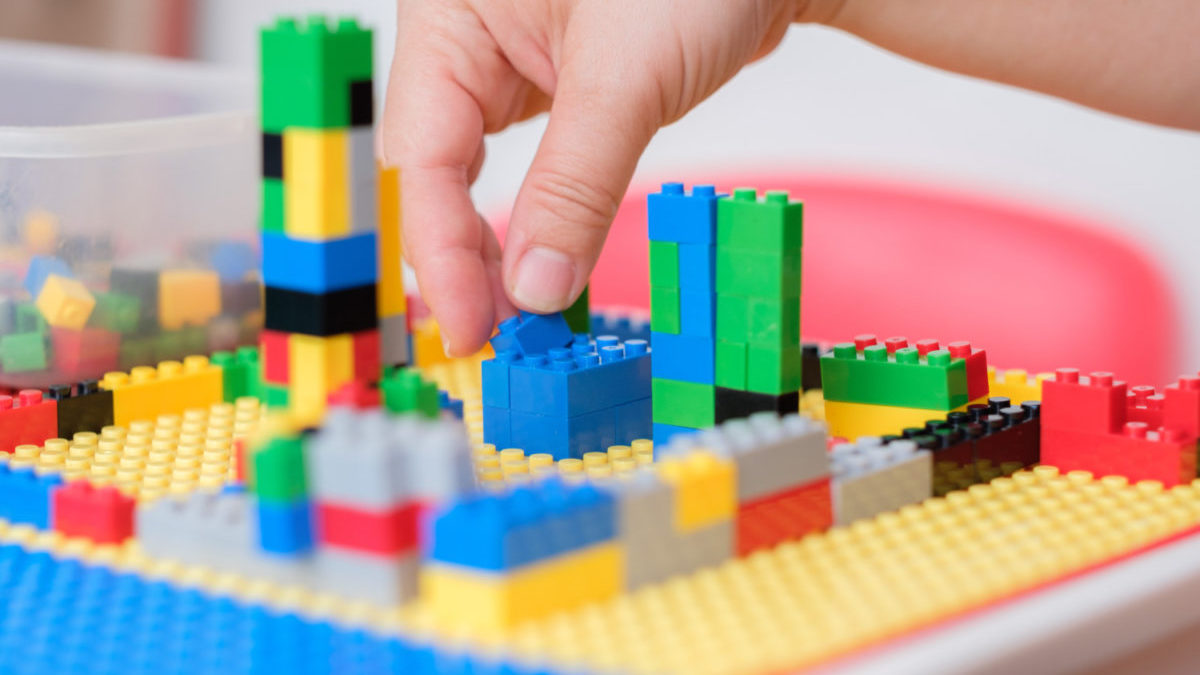 Lego bricks are connected on a tabletop surface.