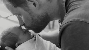 Prince Harry kisses infant Lilibet