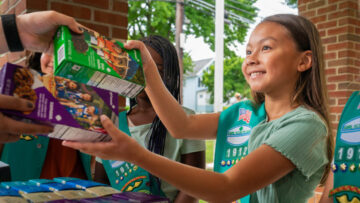 Girl Scout sells cookies