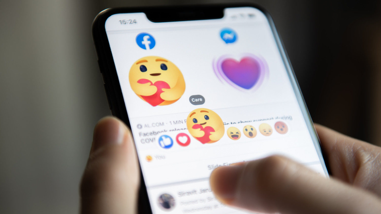 Emojis appear on smartphone screen on Facebook