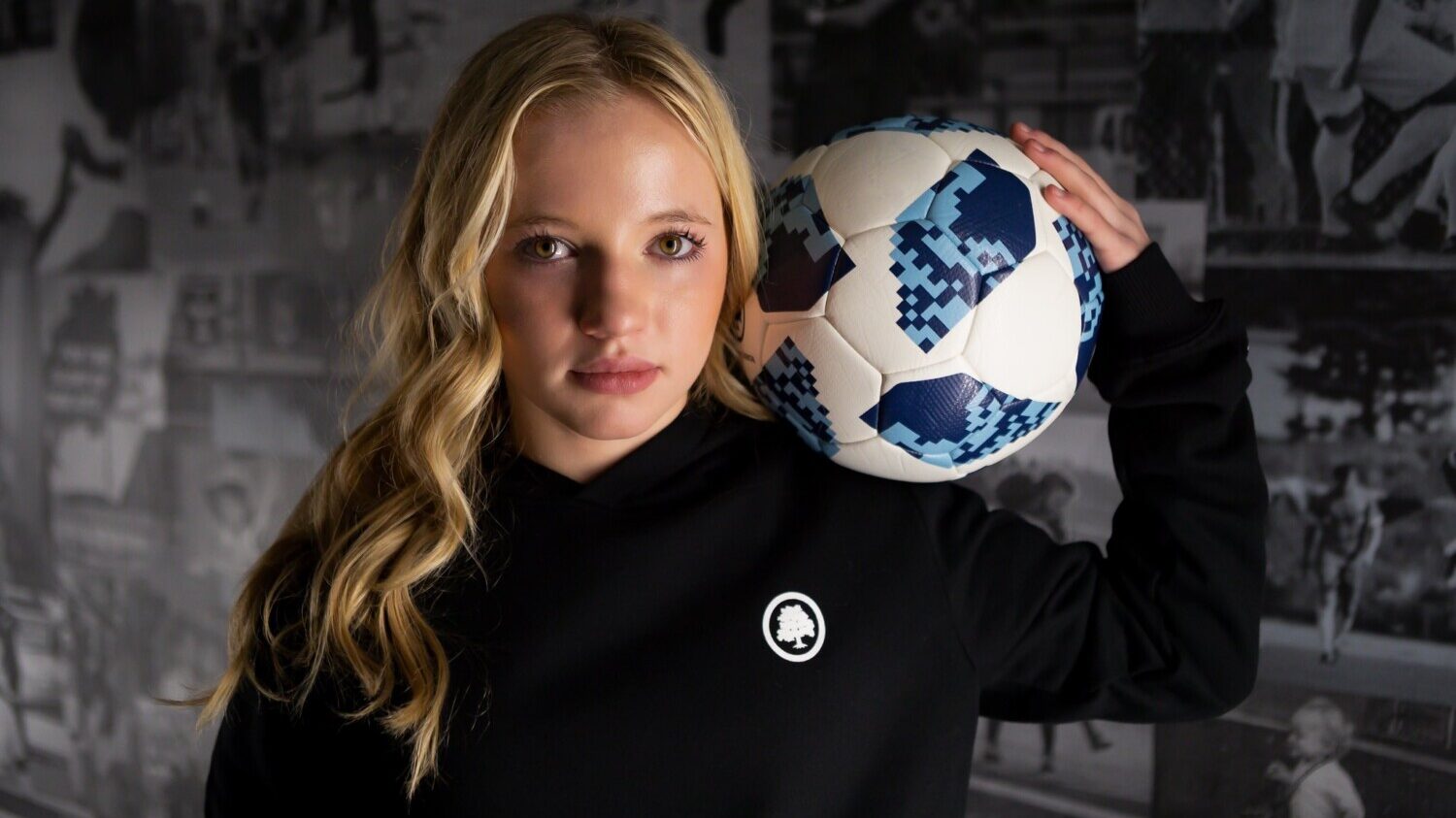 Chloe Ricketts holds soccer ball for portrait