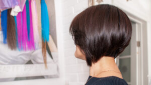 Brunette woman with short bob haircut in a beauty salon