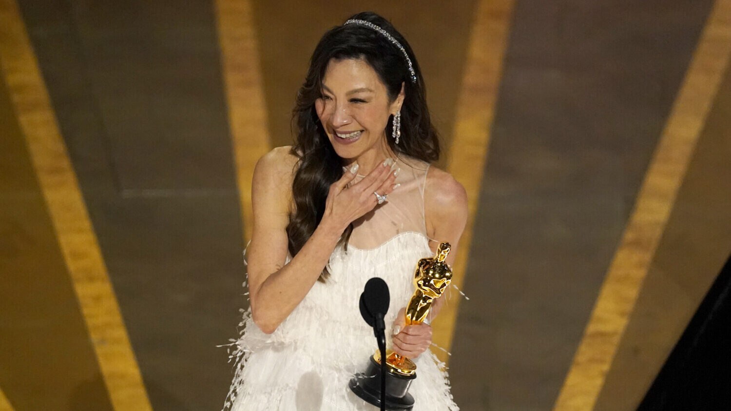 Michelle Yeoh accepts Oscar award
