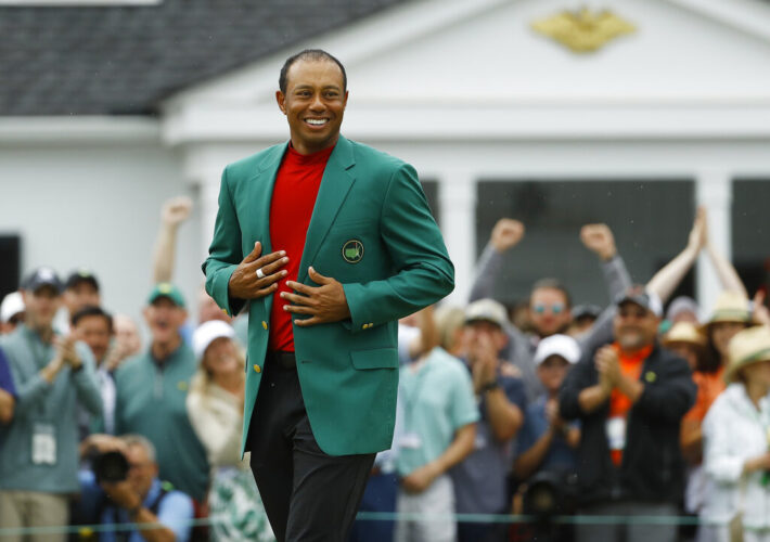 Tiger Woods smiles as he wears his green jacket after winning the Masters golf tournament Sunday, April 14, 2019, in Augusta, Ga. (AP Photo/Matt Slocum)