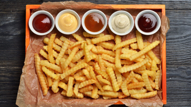 French fries with several condiments