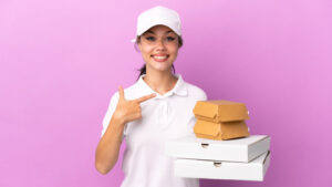 Teen points to pizzas she's delivering