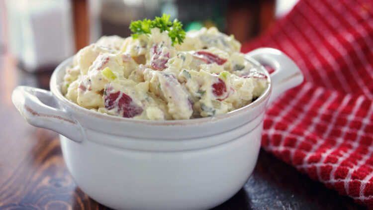 Potato salad in white bowl