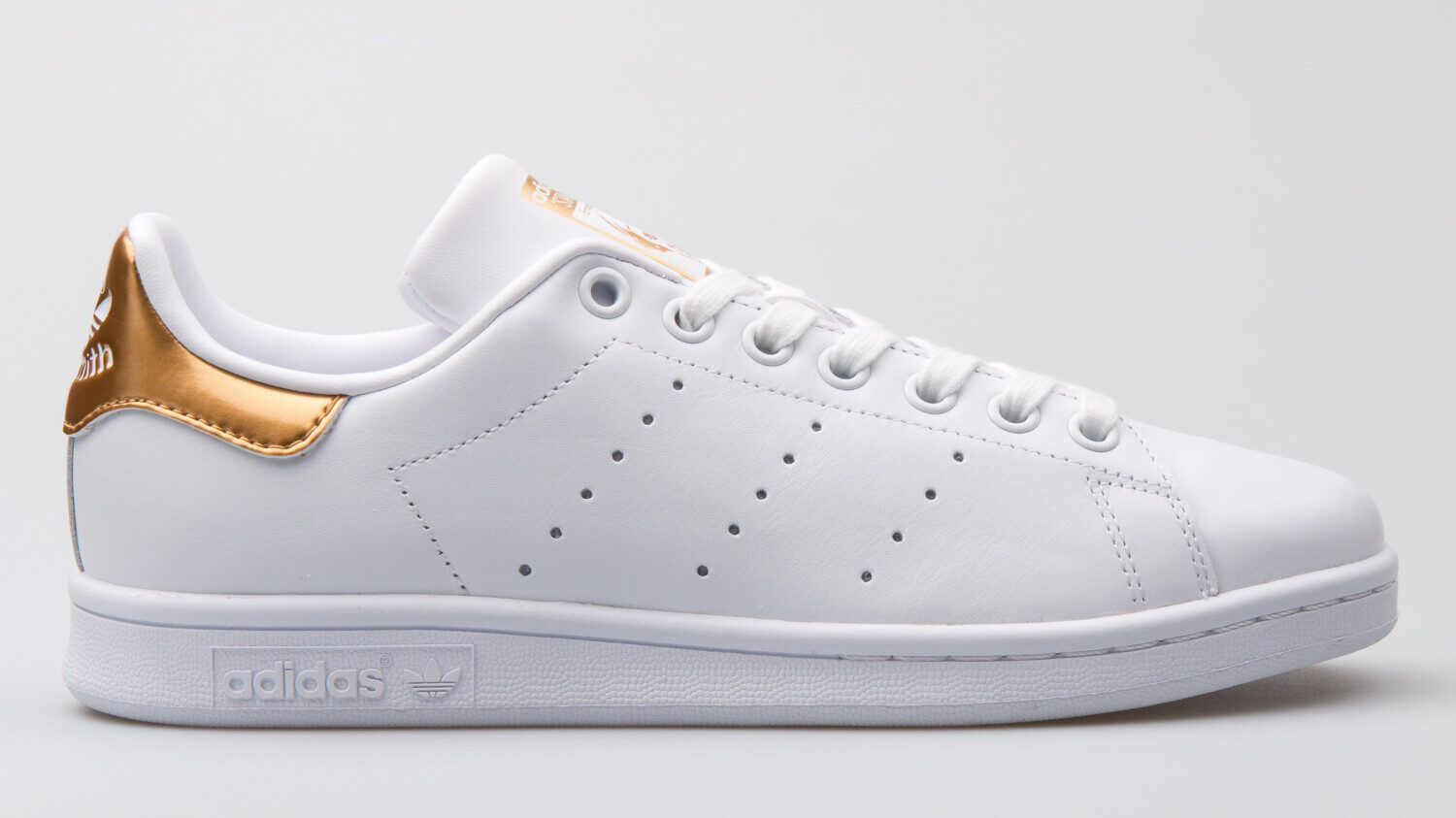 Adidas Stan Smith sneaker in white/gold